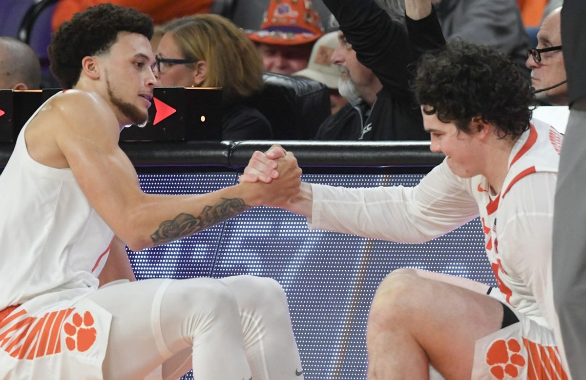 Clemson guard Chase Hunter (1) and Clemson senior forward Ian Schieffelin (4) help each other up going in the game against Radford during the second half at Littlejohn Coliseum Thursday, November 21, 2024; Clemson, SC, USA.