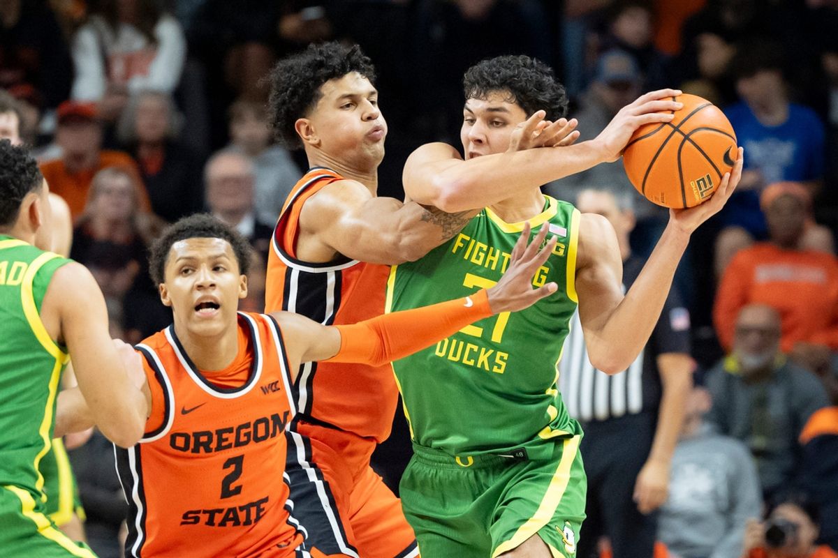 Oregon forward Brandon Angel looks for room to move under coverage from Oregon State forward Michael Rataj as the Oregon State Beavers host the Oregon Ducks Thursday, Nov. 21, 2024 at Gill Coliseum in Corvallis, Ore.