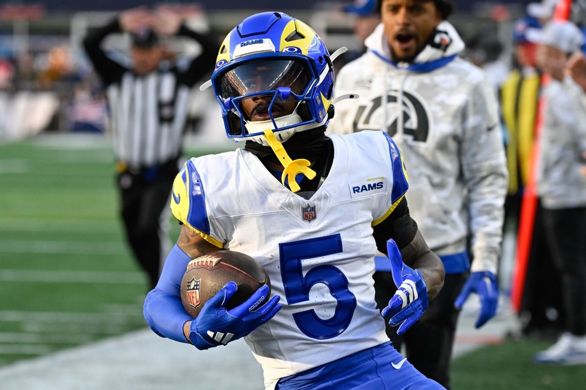 Nov 17, 2024; Foxborough, Massachusetts, USA; Los Angeles Rams wide receiver Tutu Atwell (5) runs out of bounds after making a catch during the second half against the New England Patriots at Gillette Stadium. Mandatory Credit: Eric Canha-Imagn Images