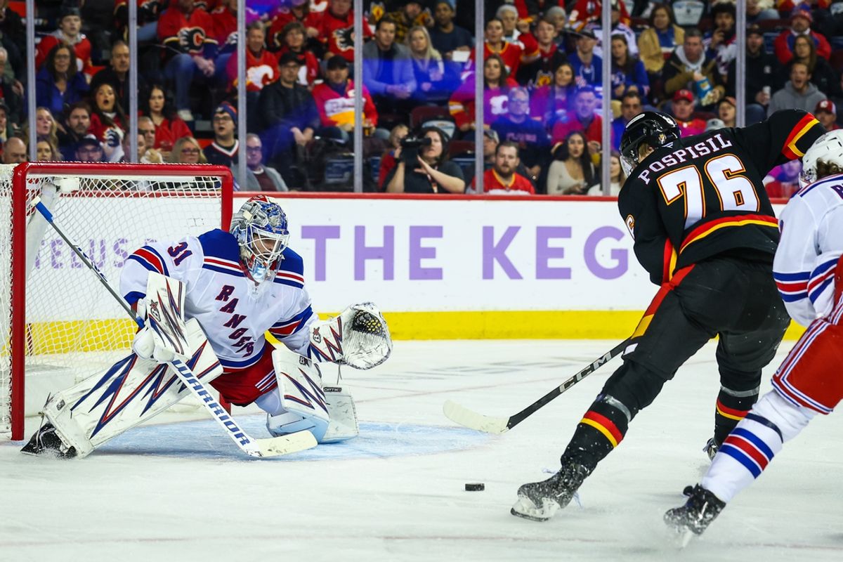 Nov 21, 2024; Calgary, Alberta, CAN; New York Rangers goaltender Igor Shesterkin (31) guards his net against Calgary Flames center Martin Pospisil (76) during the second period at Scotiabank Saddledome. Mandatory Credit: Sergei Belski-Imagn Images