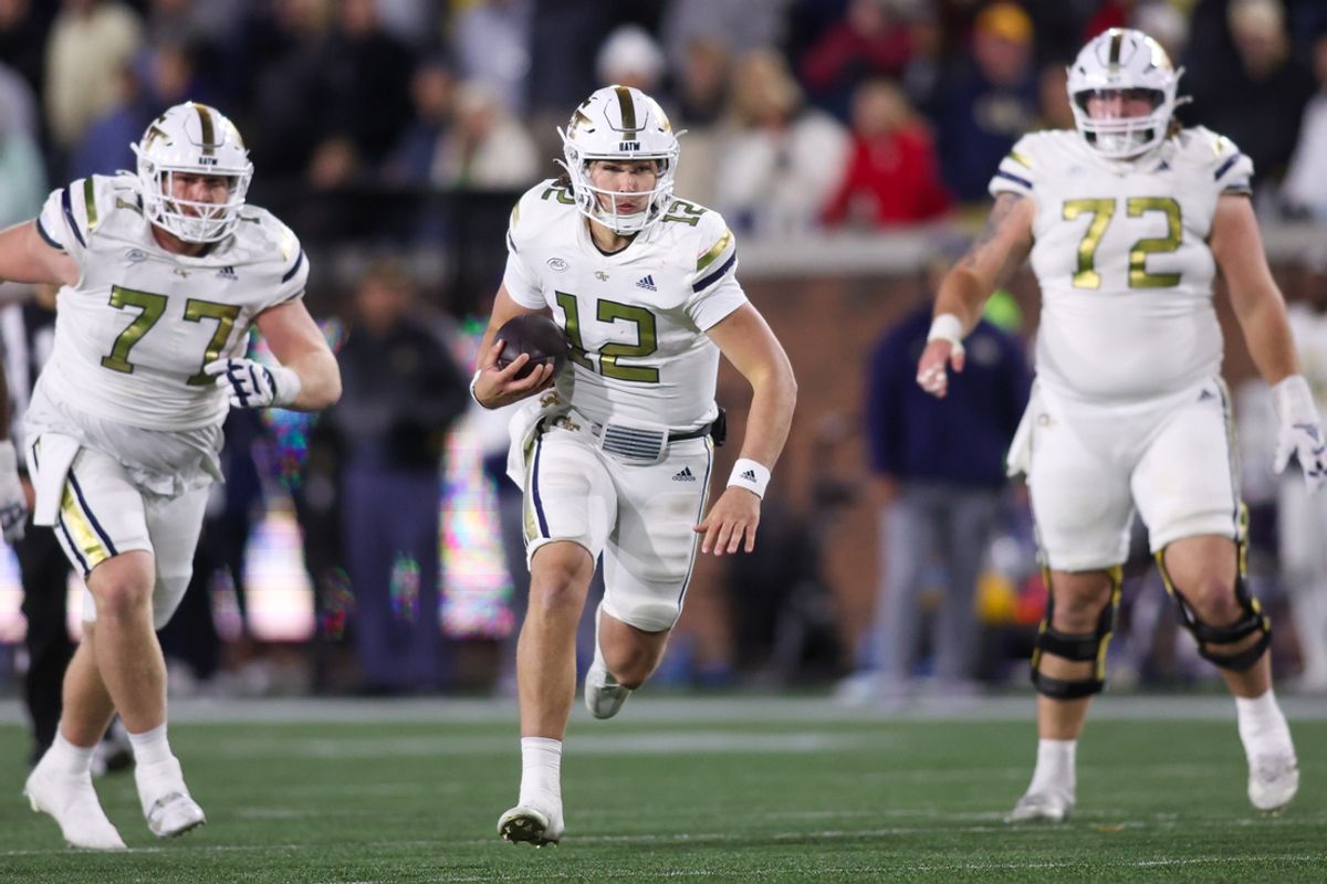 Nov 21, 2024; Atlanta, Georgia, USA; Georgia Tech Yellow Jackets quarterback Aaron Philo (12) runs the ball for a touchdown against the North Carolina State Wolfpack in the fourth quarter at Bobby Dodd Stadium at Hyundai Field. Mandatory Credit: Brett Davis-Imagn Images