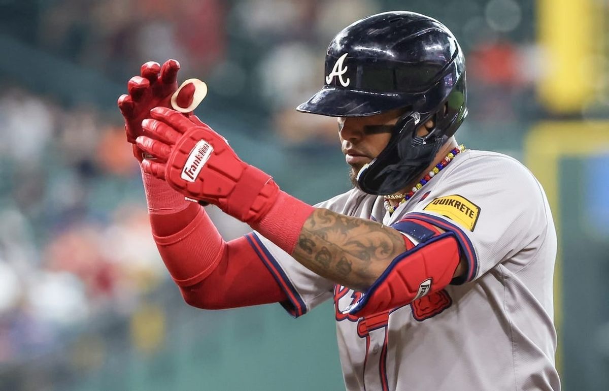 Apr 17, 2024; Houston, Texas, USA; Atlanta Braves shortstop Orlando Arcia (11) hits a RBI single against the Houston Astros in the10th inning at Minute Maid Park.