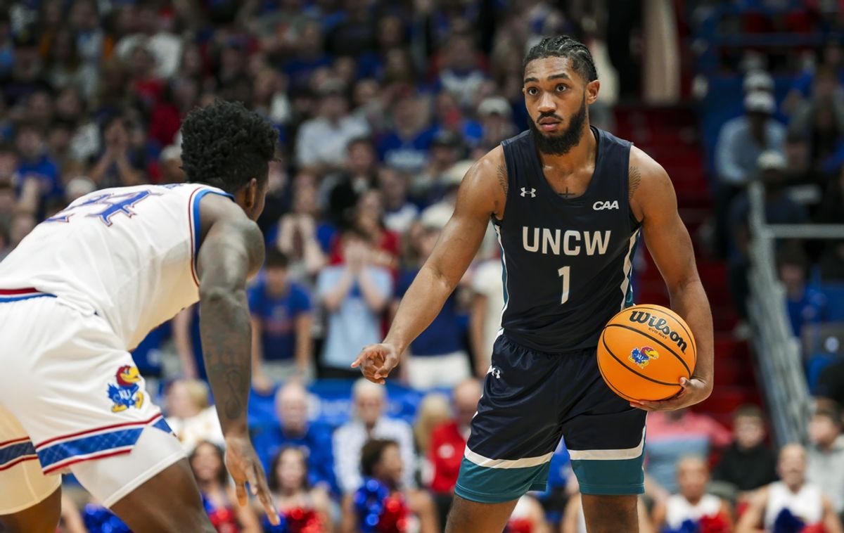 Nov 19, 2024; Lawrence, Kansas, USA; North Carolina-Wilmington Seahawks guard Donovan Newby (1) calls a play during the first half against the Kansas Jayhawks at Allen Fieldhouse. Mandatory Credit: Jay Biggerstaff-Imagn Images