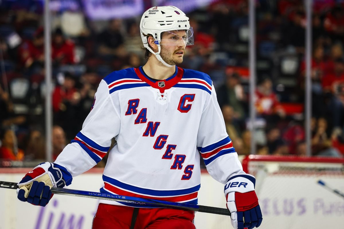 Nov 21, 2024; Calgary, Alberta, CAN; New York Rangers defenseman Jacob Trouba (8) against the Calgary Flames during the second period at Scotiabank Saddledome. Mandatory Credit: Sergei Belski-Imagn Images
