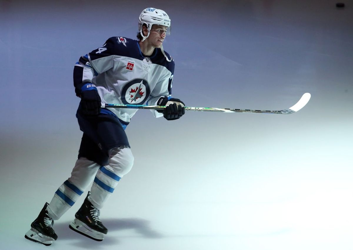 Nov 22, 2024; Pittsburgh, Pennsylvania, USA; Winnipeg Jets defenseman Haydn Fleury (24) takes the ice to warm up against the Pittsburgh Penguins at PPG Paints Arena. Mandatory Credit: Charles LeClaire-Imagn Images
