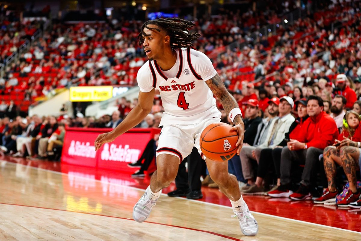 Nov 22, 2024; Raleigh, North Carolina, USA; North Carolina State Wolfpack guard Breon Pass (4) dribbles the ball during the first half of the game against the William & Mary Tribe at Lenovo Center. Mandatory Credit: Jaylynn Nash-Imagn Images