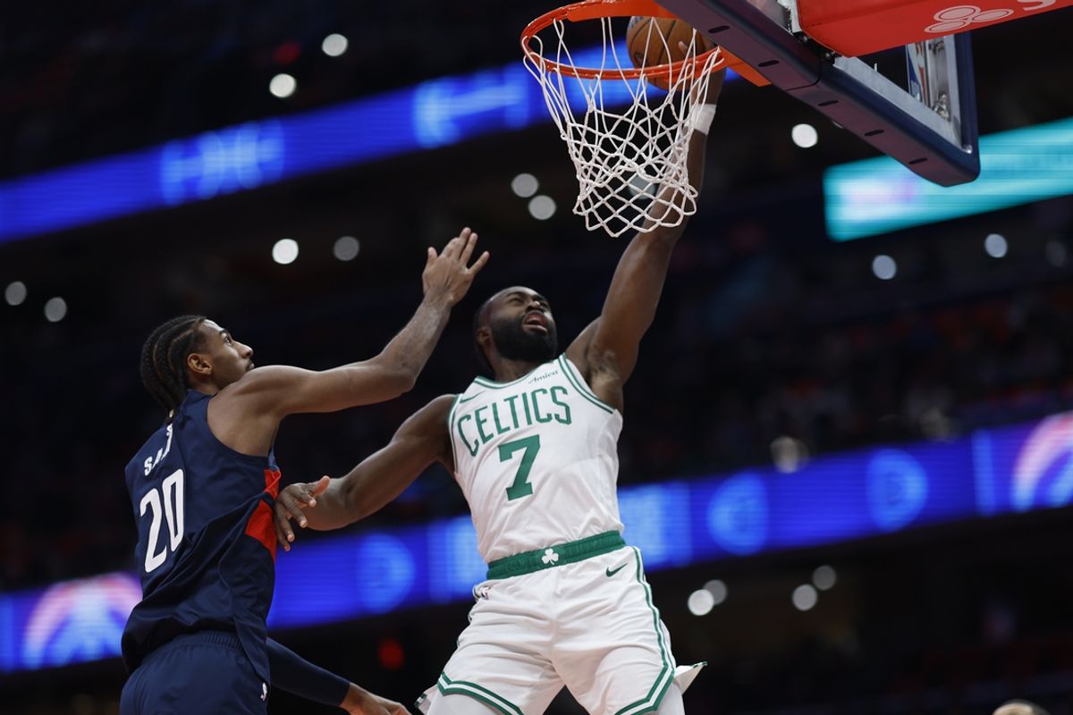 Nov 22, 2024; Washington, District of Columbia, USA; Boston Celtics guard Jaylen Brown (7) shoots the ball as Washington Wizards forward Alexandre Sarr (20) defends in the first half at Capital One Arena. Mandatory Credit: Geoff Burke-Imagn Images