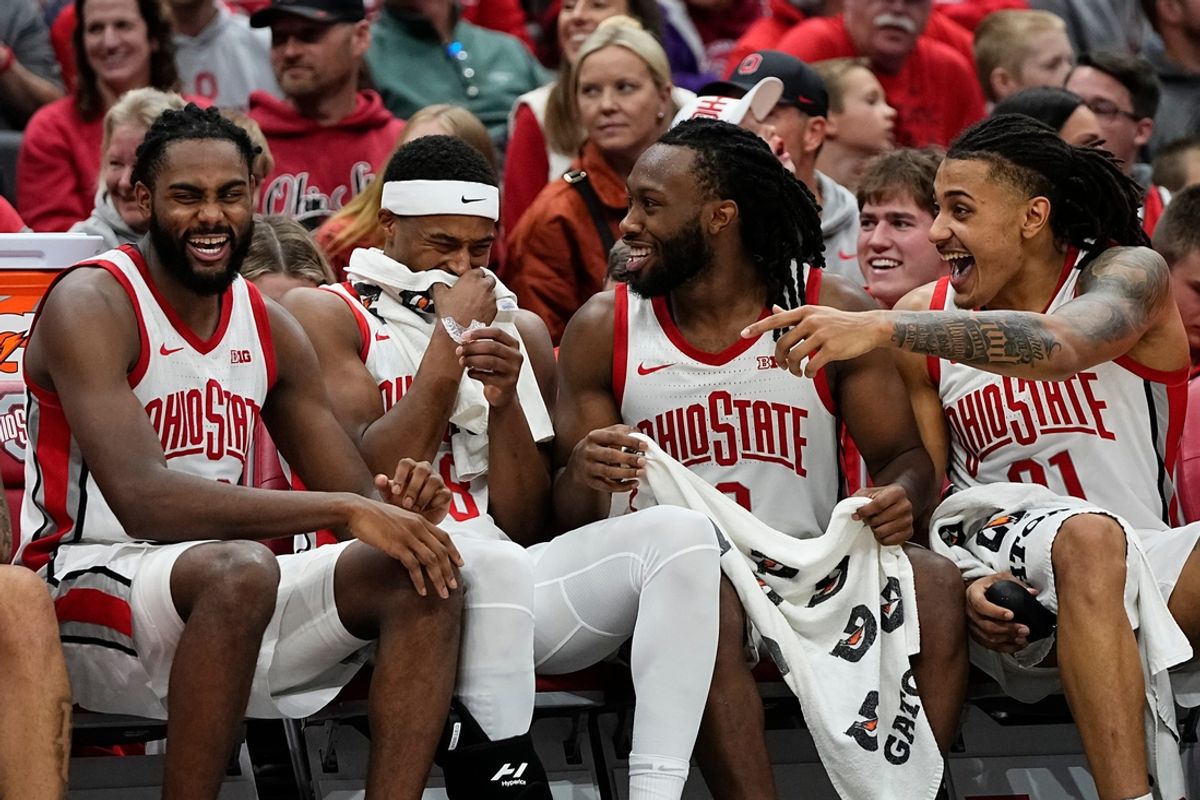 Ohio State Buckeyes guard Evan Mahaffey (12), guard Micah Parrish (8), guard Bruce Thornton (2) and forward Devin Royal (21) laugh on the benc during the second half of the NCAA men's basketball game against the Campbell Fighting Camels at Value City Arena in Columbus on Friday, Nov. 22, 2024. Ohio State won 104-60.