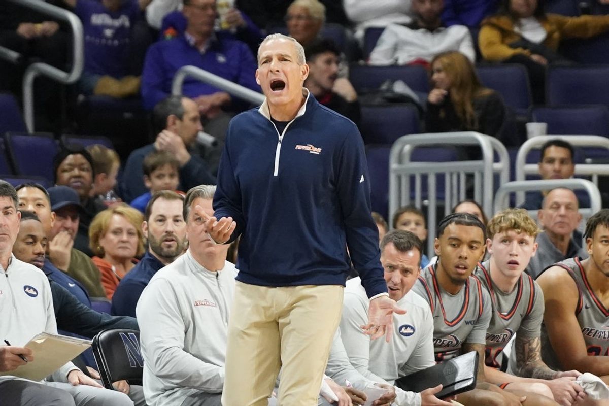 Nov 22, 2024; Evanston, Illinois, USA; Pepperdine Waves head coach Ed Schilling gestures to his team against the Northwestern Wildcats during the first half at Welsh-Ryan Arena. Mandatory Credit: David Banks-Imagn Images