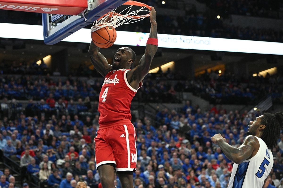 Nov 22, 2024; Omaha, Nebraska, USA; Nebraska Cornhuskers forward Juwan Gary (4) dunks against the Creighton Bluejays during the first half at CHI Health Center Omaha. Mandatory Credit: Steven Branscombe-Imagn Images