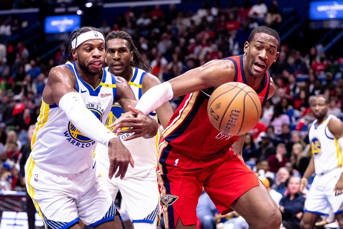 Nov 22, 2024; New Orleans, Louisiana, USA;  New Orleans Pelicans center Trey Jemison III (55) and Golden State Warriors guard Buddy Hield (7) go for a loose ball during first half at Smoothie King Center. Mandatory Credit: Stephen Lew-Imagn Images