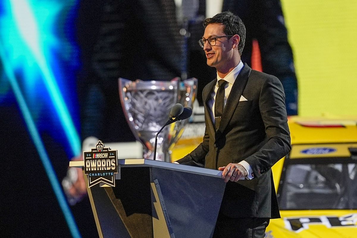 Nov 22, 2024; Charlotte, NC, USA;  NASCAR Cup Series driver Joey Logano (22) talks to the audience after being announced as the three time Cup champion during the NASCAR Awards Banquet at Charlotte Convention Center. Mandatory Credit: Jim Dedmon-Imagn Images