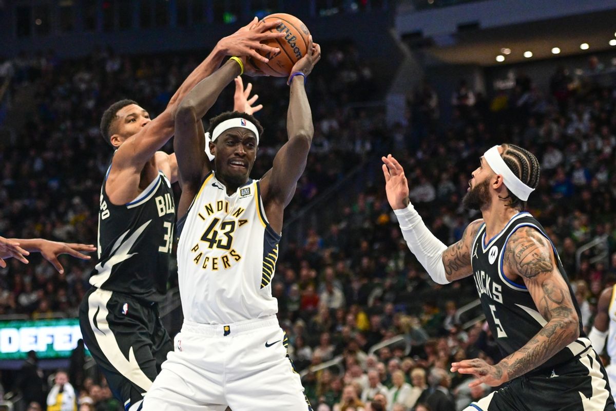 Nov 22, 2024; Milwaukee, Wisconsin, USA; Milwaukee Bucks forward Giannis Antetokounmpo (34) and guard Gary Trent Jr. (5) put pressure on Indiana Pacers forward Pascal Siakam (43) in the second quarter at Fiserv Forum. Mandatory Credit: Benny Sieu-Imagn Images