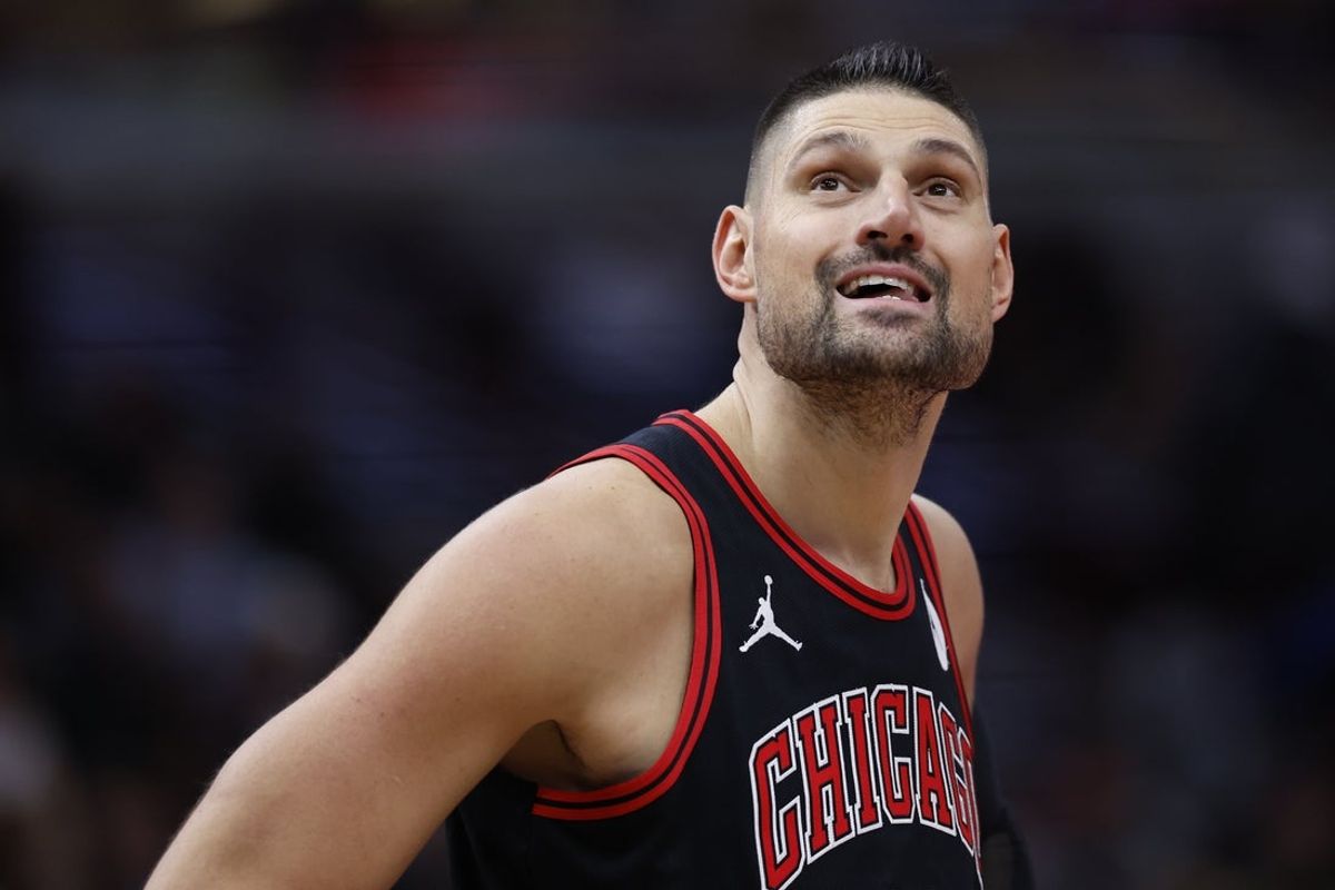 Nov 22, 2024; Chicago, Illinois, USA; Chicago Bulls center Nikola Vucevic (9) reacts during the first half against the Atlanta Hawks at United Center. Mandatory Credit: Kamil Krzaczynski-Imagn Images