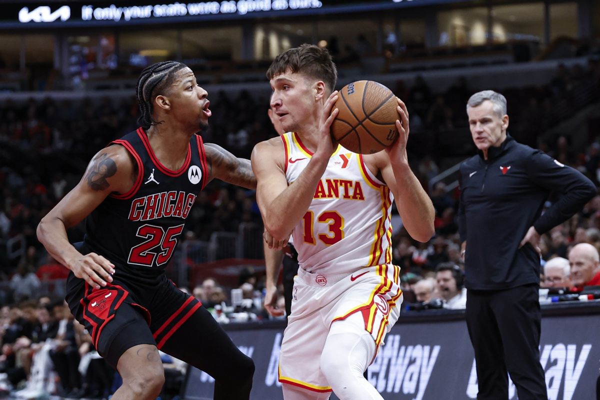 Nov 22, 2024; Chicago, Illinois, USA; Chicago Bulls forward Dalen Terry (25) defends against Atlanta Hawks guard Bogdan Bogdanovic (13) during the second half at United Center. Mandatory Credit: Kamil Krzaczynski-Imagn Images