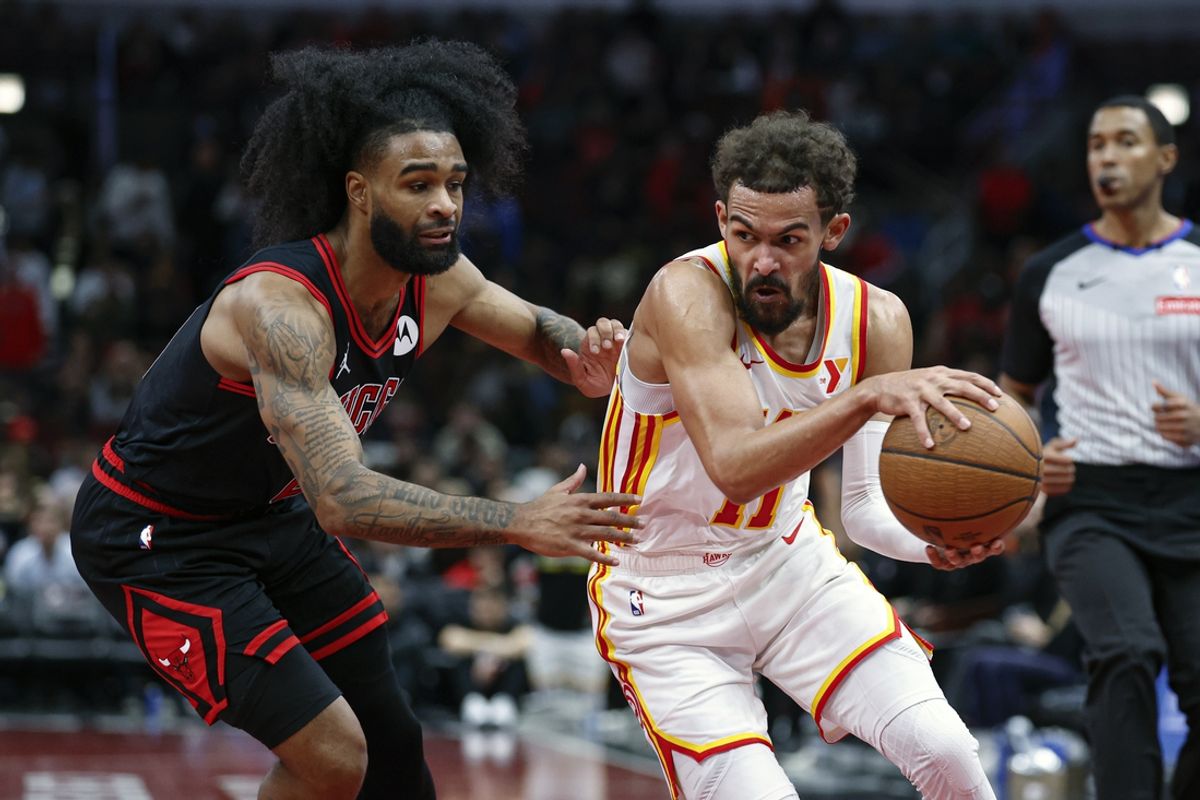 Nov 22, 2024; Chicago, Illinois, USA; Atlanta Hawks guard Trae Young (11) drives to the basket against Chicago Bulls guard Coby White (0) during the second half at United Center. Mandatory Credit: Kamil Krzaczynski-Imagn Images