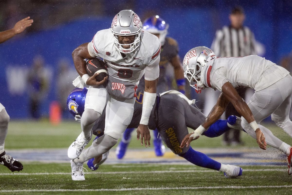 Nov 22, 2024; San Jose, California, USA; UNLV Rebels quarterback Hajj-Malik Williams (6) breaks a big gainer against the San Jose State Spartans during the third quarter at CEFCU Stadium. Mandatory Credit: D. Ross Cameron-Imagn Images