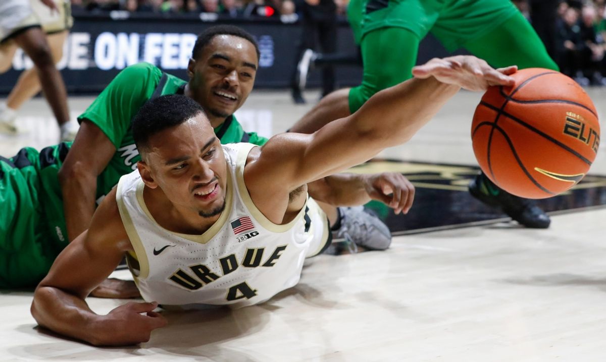 Marshall Thundering Herd guard Jalen Speer (50) and Purdue Boilermakers forward Trey Kaufman-Renn (4) dive for a loose ball Saturday, Nov. 23, 2024, during the NCAA men’s basketball game at Mackey Arena in West Lafayette, Ind.