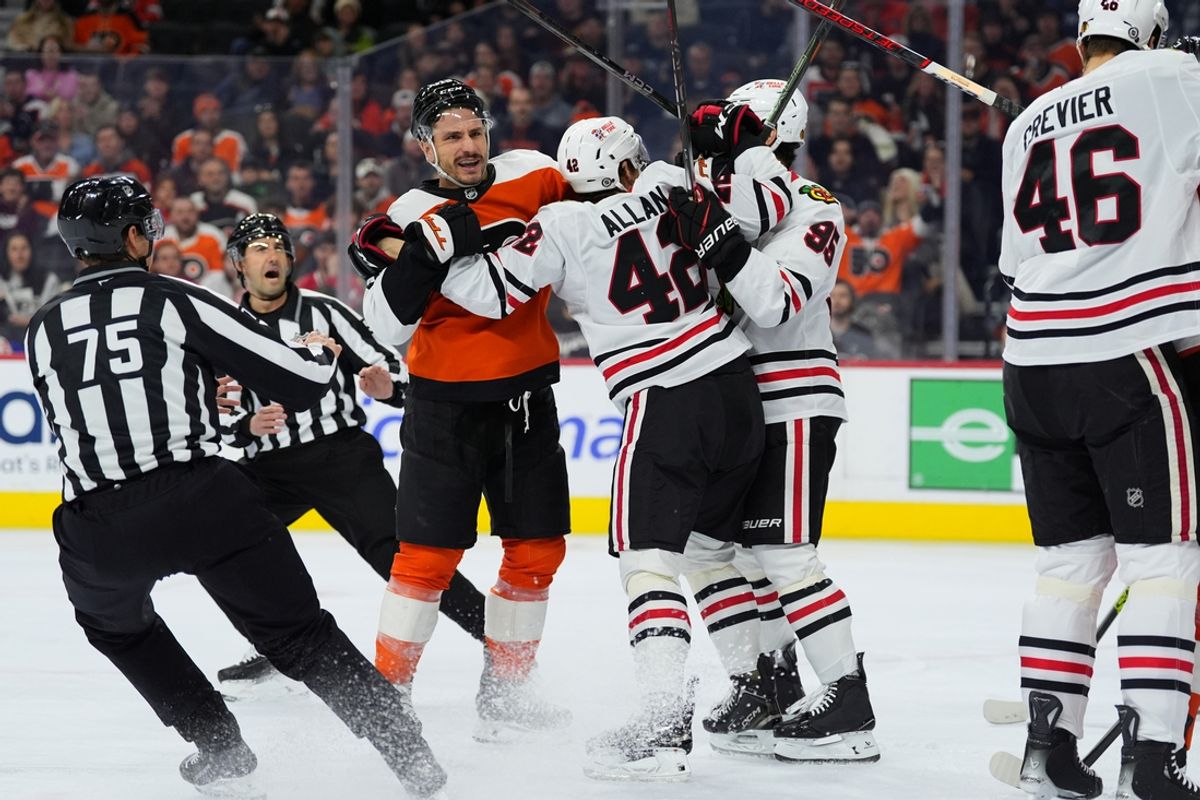 Nov 23, 2024; Philadelphia, Pennsylvania, USA; Philadelphia Flyers right wing Garnet Hathaway (19) reacts during a scuffle with Chicago Blackhawks defenseman Nolan Allan (42) in the first period at Wells Fargo Center. Mandatory Credit: Kyle Ross-Imagn Images