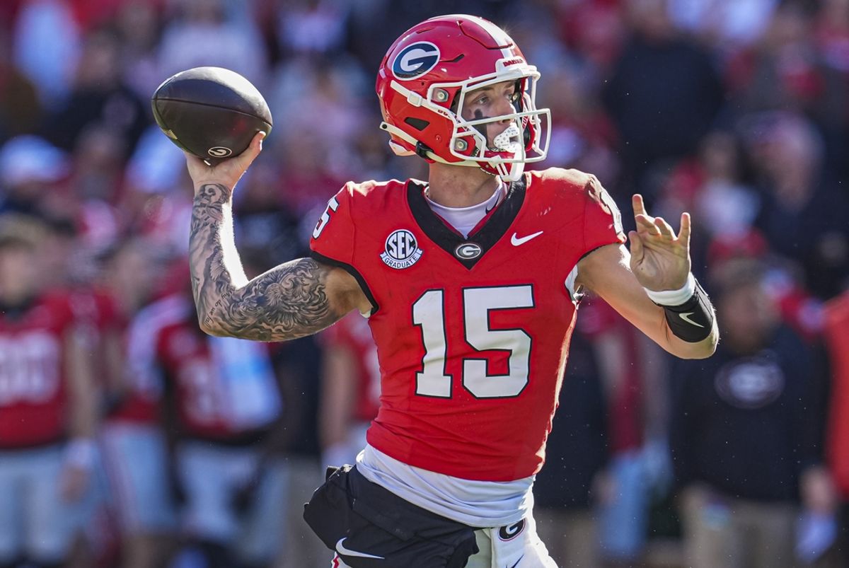 Nov 23, 2024; Athens, Georgia, USA; Georgia Bulldogs quarterback Carson Beck (15) passes the ball against the Massachusetts Minutemen during the first half at Sanford Stadium. Mandatory Credit: Dale Zanine-Imagn Images