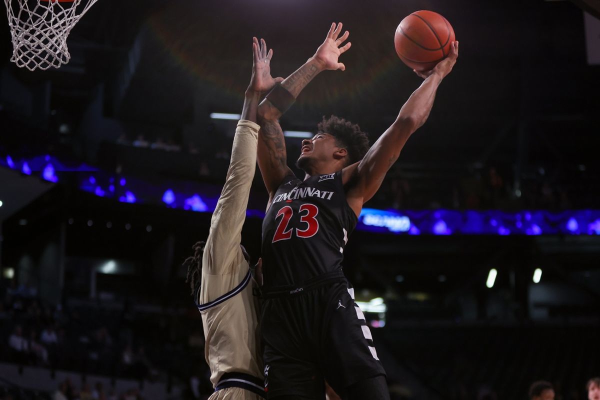Nov 23, 2024; Atlanta, Georgia, USA; Cincinnati Bearcats forward Dillon Mitchell (23) dribbles against the Georgia Tech Yellow Jackets in the first half at McCamish Pavilion. Mandatory Credit: Brett Davis-Imagn Images