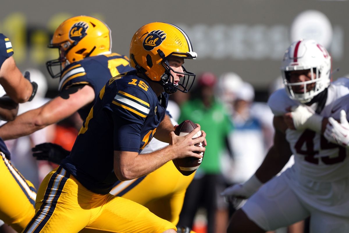 Nov 23, 2024; Berkeley, California, USA; California Golden Bears quarterback Fernando Mendoza (15) carries the ball against the Stanford Cardinal during the first quarter at California Memorial Stadium. Mandatory Credit: Darren Yamashita-Imagn Images
