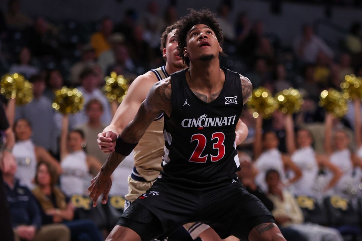 Nov 23, 2024; Atlanta, Georgia, USA; Cincinnati Bearcats forward Dillon Mitchell (23) boxes put Georgia Tech Yellow Jackets guard Lance Terry (0) in the second half at McCamish Pavilion. Mandatory Credit: Brett Davis-Imagn Images