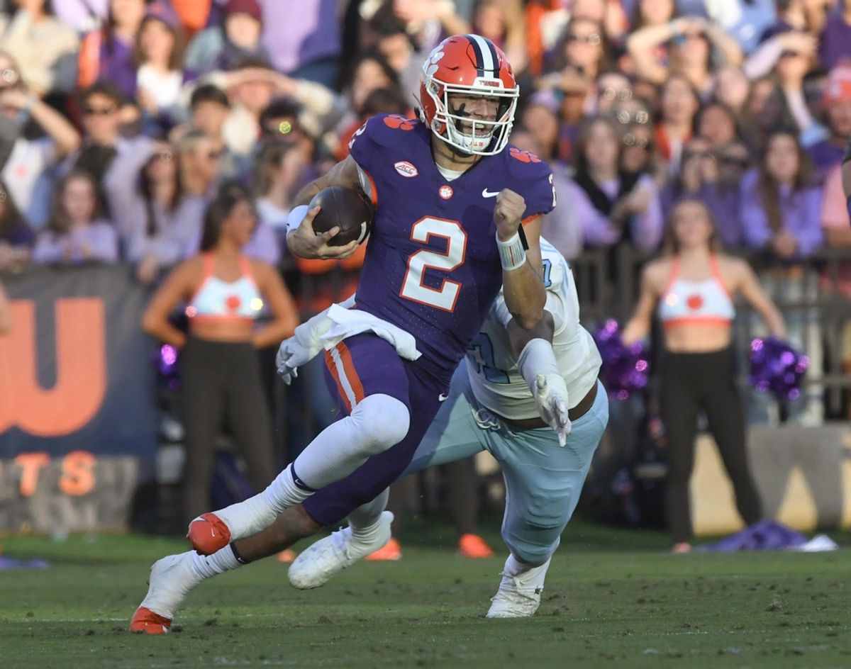 Nov 23, 2024; Clemson, South Carolina, USA; Clemson Tigers quarterback Cade Klubnik (2) runs for a first down against The Citadel Bulldogs during the second quarter at Memorial Stadium. Mandatory Credit: Ken Ruinard-Imagn Images