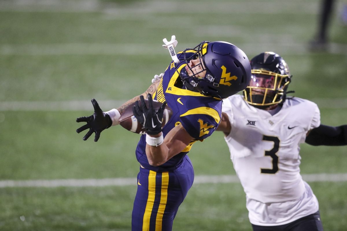 Nov 23, 2024; Morgantown, West Virginia, USA; West Virginia Mountaineers wide receiver Rodney Gallagher III (24) makes a catch for a touchdown against the UCF Knights during the second quarter at Mountaineer Field at Milan Puskar Stadium. Mandatory Credit: Ben Queen-Imagn Images