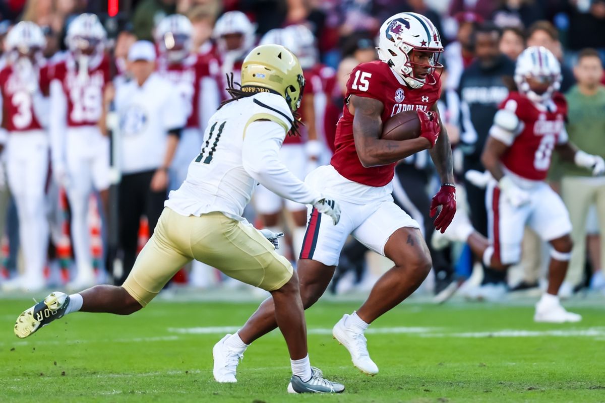 Nov 23, 2024; Columbia, South Carolina, USA; South Carolina Gamecocks wide receiver Dalevon Campbell (15) runs after a catch against Wofford Terriers defensive back Javis Mynatt (11) in the first quarter at Williams-Brice Stadium. Mandatory Credit: Jeff Blake-Imagn Images