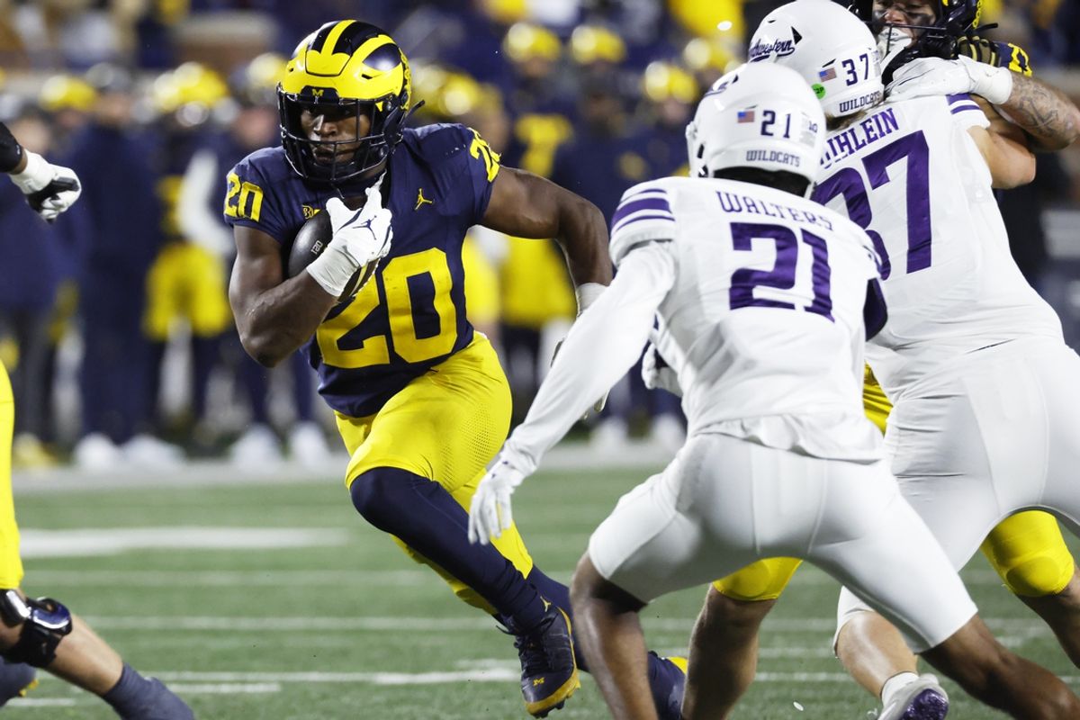 Nov 23, 2024; Ann Arbor, Michigan, USA;  Michigan Wolverines running back Kalel Mullings (20) runs the ball against the Northwestern Wildcats in the second half at Michigan Stadium. Mandatory Credit: Rick Osentoski-Imagn Images