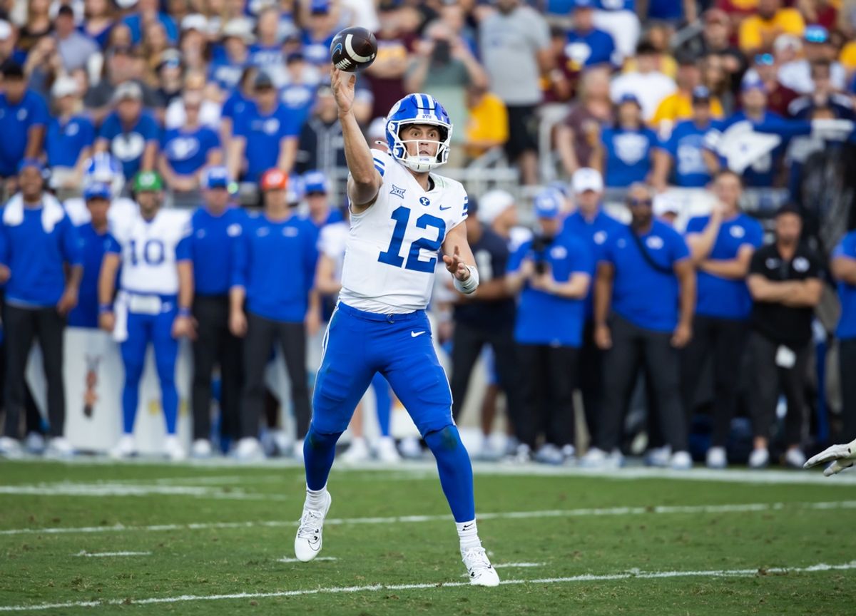Nov 23, 2024; Tempe, Arizona, USA; Brigham Young Cougars quarterback Jake Retzlaff (12) against the Arizona State Sun Devils in the second half at Mountain America Stadium. Mandatory Credit: Mark J. Rebilas-Imagn Images