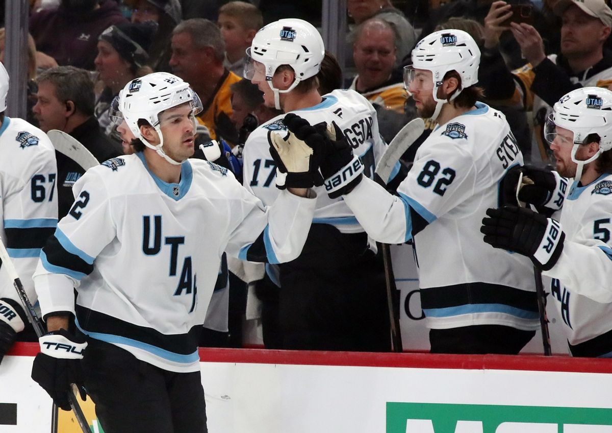 Nov 23, 2024; Pittsburgh, Pennsylvania, USA;  Utah Hockey Club center Jack McBain (22) celebrates his goal with the Utah bench against the Pittsburgh Penguins during the first period at PPG Paints Arena. Mandatory Credit: Charles LeClaire-Imagn Images