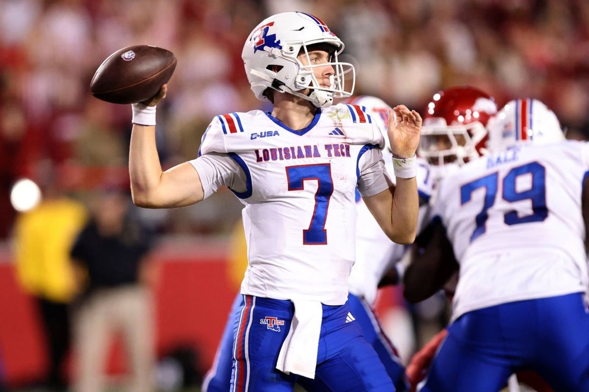 Nov 23, 2024; Fayetteville, Arkansas, USA; Louisiana Tech Bulldogs quarterback Evan Bullock (7) passes during the fourth quarter against the Arkansas Razorbacks at Donald W. Reynolds Razorback Stadium. Arkansas won 35-14. Mandatory Credit: Nelson Chenault-Imagn Images