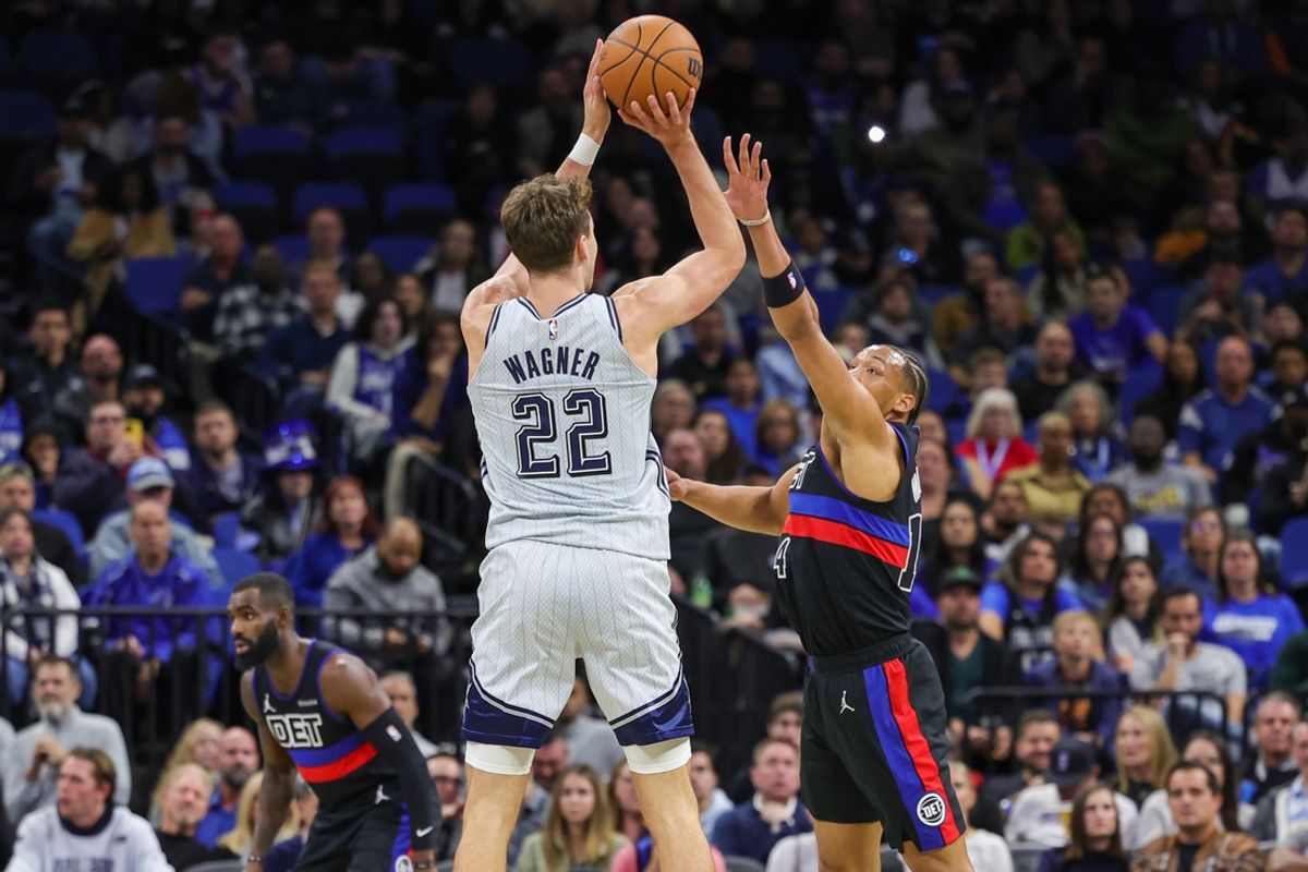 Nov 23, 2024; Orlando, Florida, USA; Orlando Magic forward Franz Wagner (22) shoots the ball against Detroit Pistons guard Wendell Moore Jr. (14) during the second quarter at Kia Center. Mandatory Credit: Mike Watters-Imagn Images
