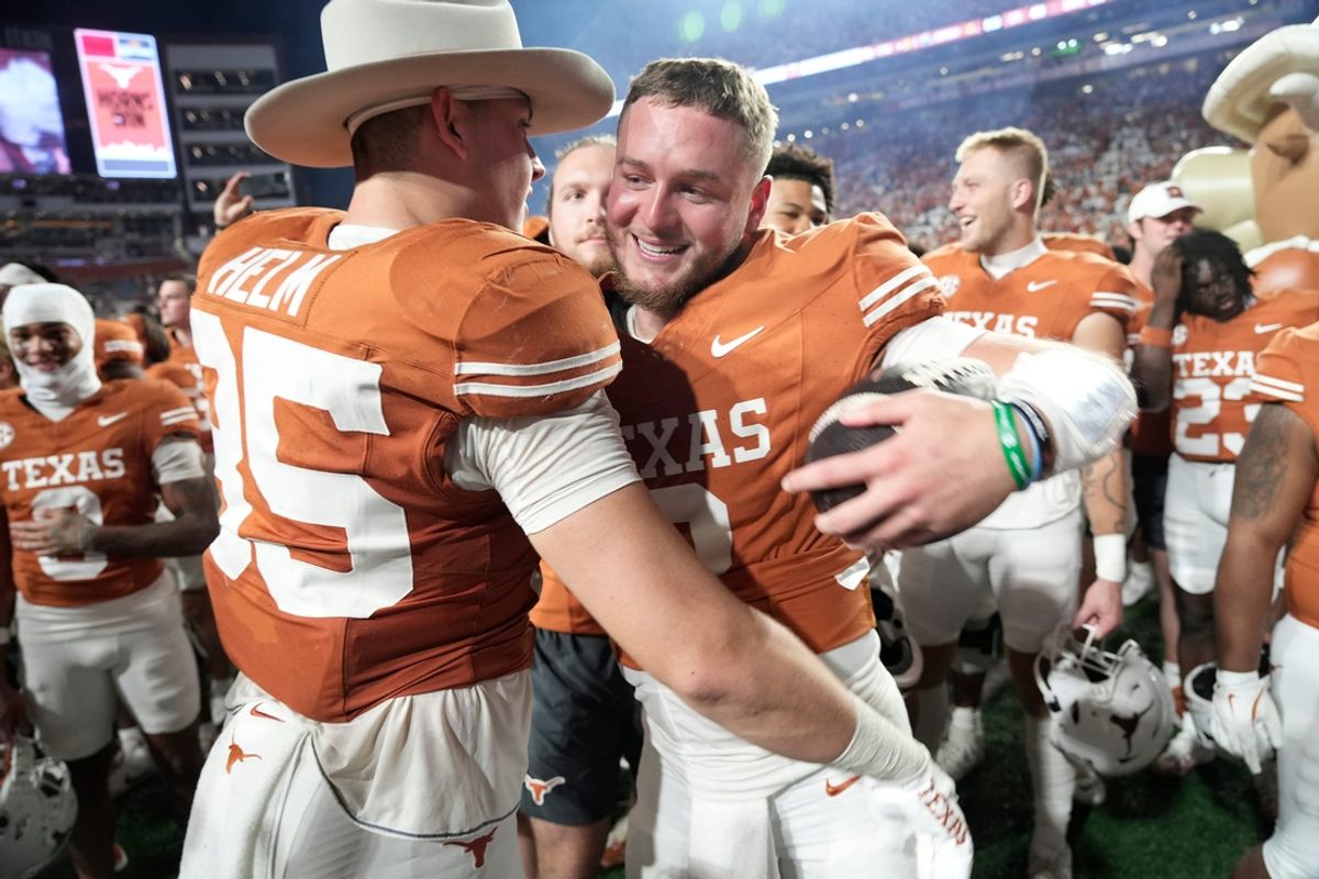 Texas Longhorns quarterback Quinn Ewers (3) hugs Texas Longhorns tight end Gunnar Helm (85) at the end of the game against Kentucky Wildcats in a NCAA college football game at Darrell K Royal Texas Memorial Stadium, Austin, Texas, Saturday, Nov 24, 2024.