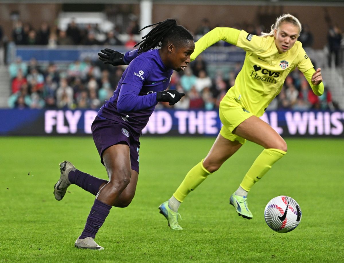 Nov 23, 2024; Kansas City, Missouri, USA;   Orlando Pride forward Barbra Banda (22) in action against Washington Spirit defender Esme Morgan (24) in the 2024 NWSL Championship match at CPKC Stadium. Mandatory Credit: Amy Kontras-Imagn Images