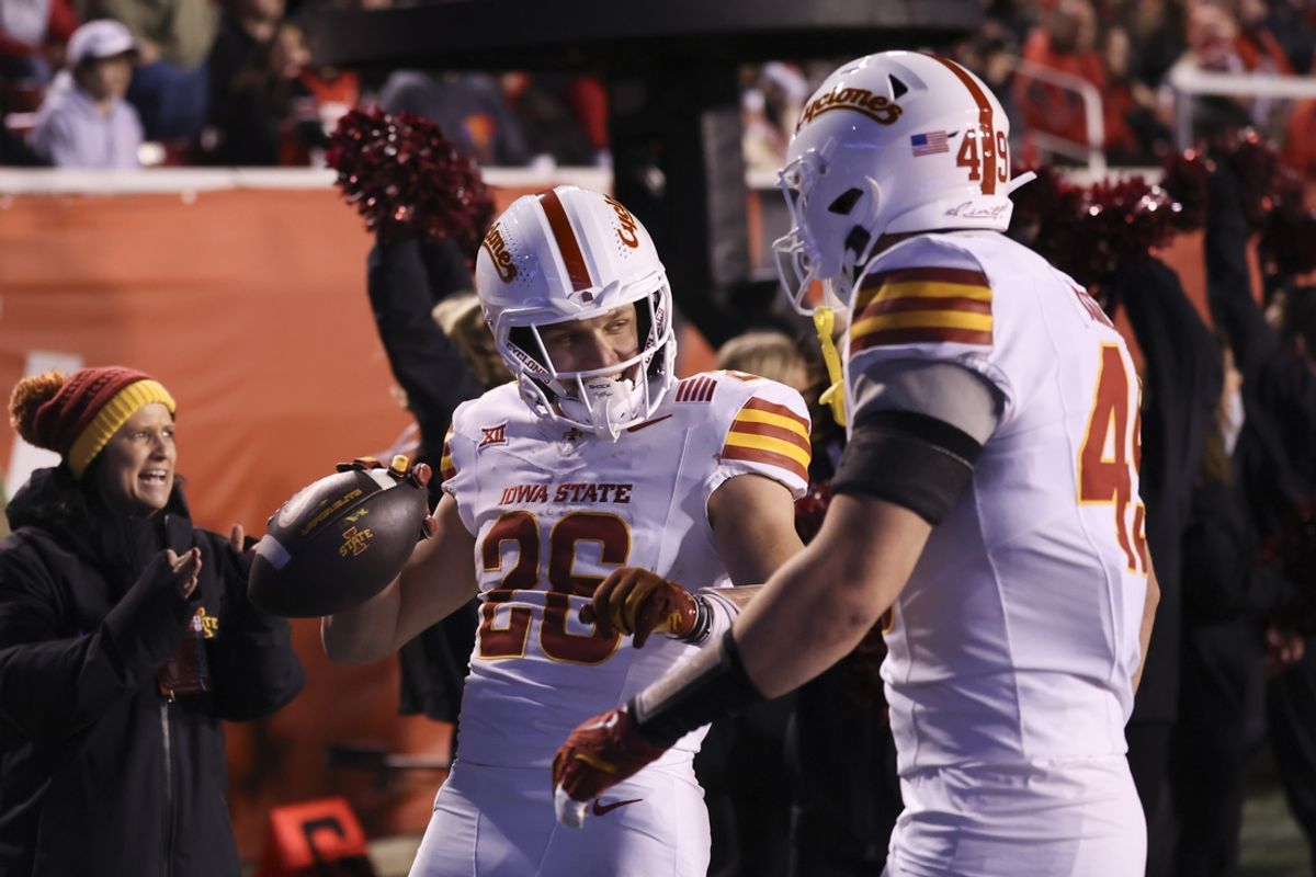 Nov 23, 2024; Salt Lake City, Utah, USA; Iowa State Cyclones running back Carson Hansen (26) celebrates a touchdown against the Utah Utes during the second quarter at Rice-Eccles Stadium. Mandatory Credit: Rob Gray-Imagn Images