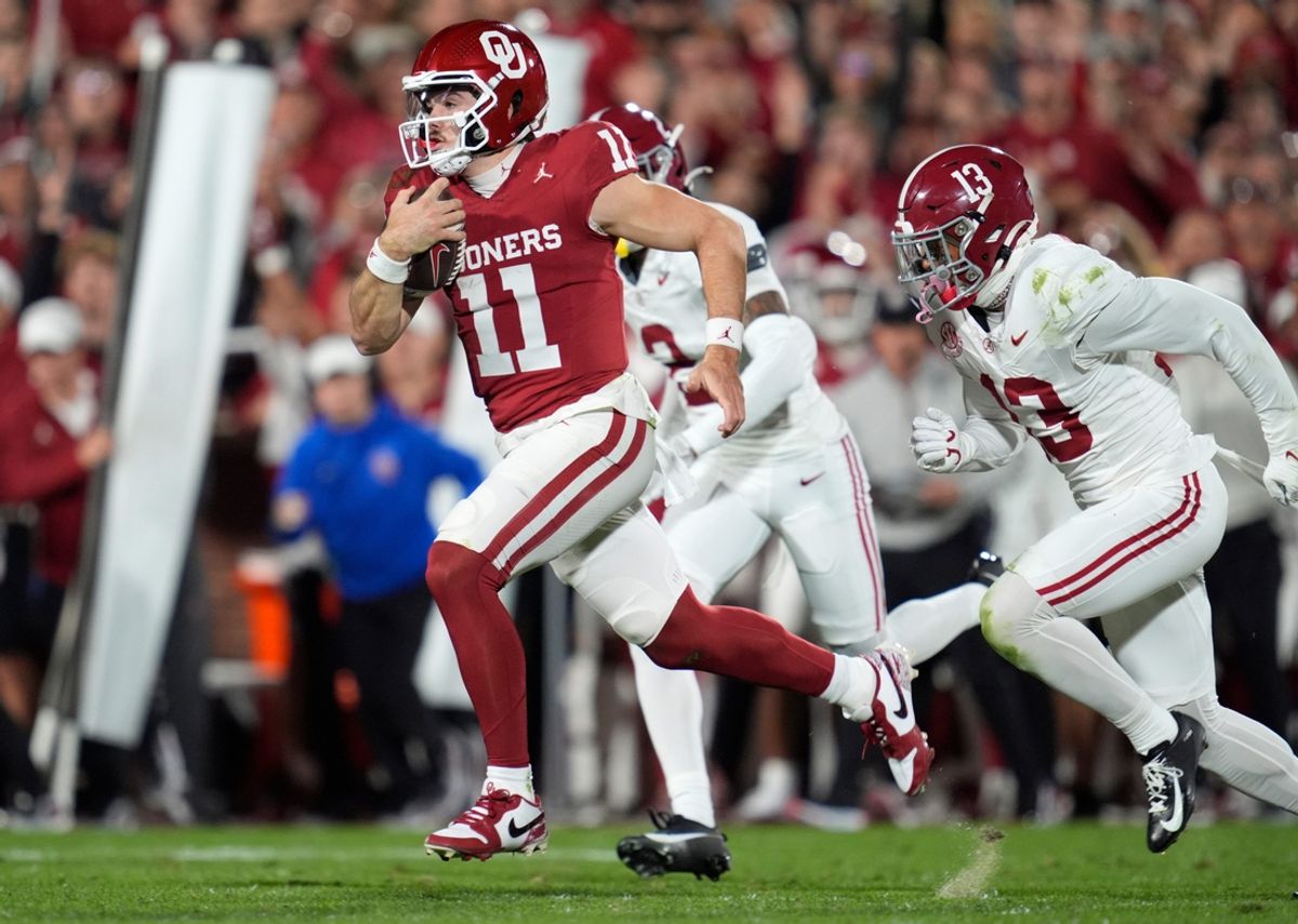 Alabama Crimson Tide defensive back Malachi Moore (13) chases after Oklahoma Sooners quarterback Jackson Arnold (11) during a college football game between the University of Oklahoma Sooners (OU) and the Alabama Crimson Tide at Gaylord Family - Oklahoma Memorial Stadium in Norman, Okla., Saturday, Nov. 23, 2024.