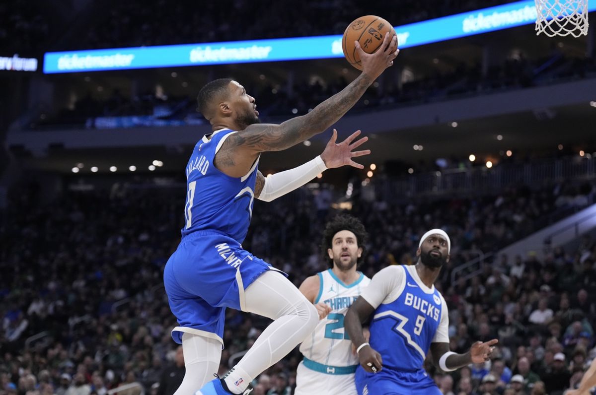 Nov 23, 2024; Milwaukee, Wisconsin, USA; Milwaukee Bucks guard Damian Lillard (0) drives to the basket against Charlotte Hornets in the first half at Fiserv Forum. Mandatory Credit: Michael McLoone-Imagn Images