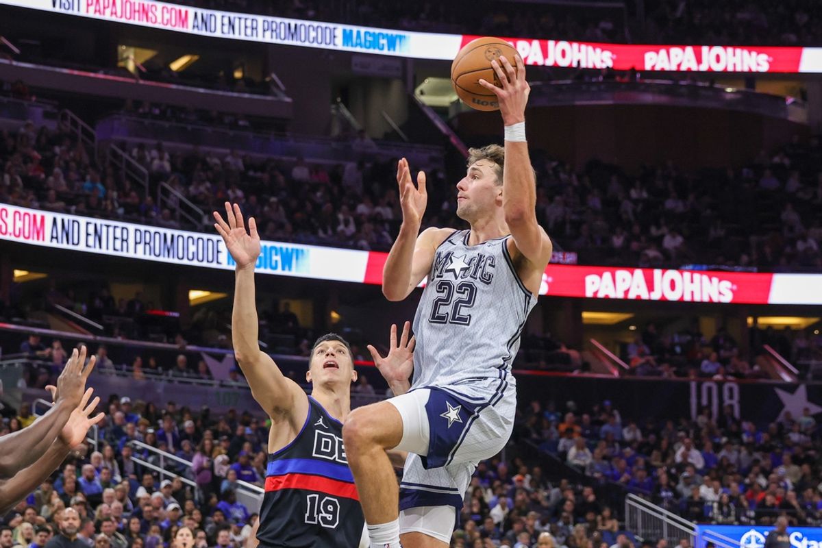 Nov 23, 2024; Orlando, Florida, USA; Orlando Magic forward Franz Wagner (22) shoots the ball against Detroit Pistons forward Simone Fontecchio (19) during the second half at Kia Center. Mandatory Credit: Mike Watters-Imagn Images
