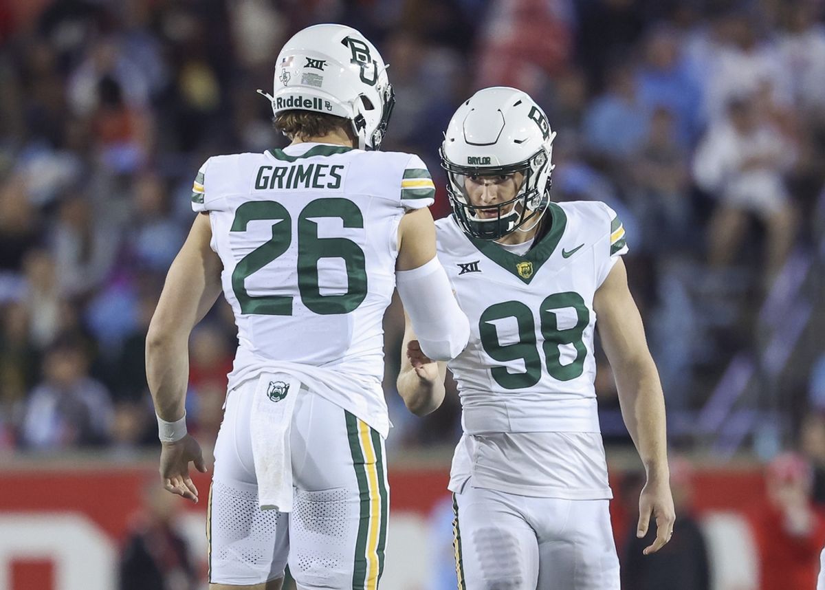 Nov 23, 2024; Houston, Texas, USA; DUPLICATE***Baylor Bears place kicker Isaiah Hankins (98) celebrates with long snapper Garrison Grimes (26) after making a field goal during the fourth quarter against the Houston Cougars at TDECU Stadium. Mandatory Credit: Troy Taormina-Imagn Images