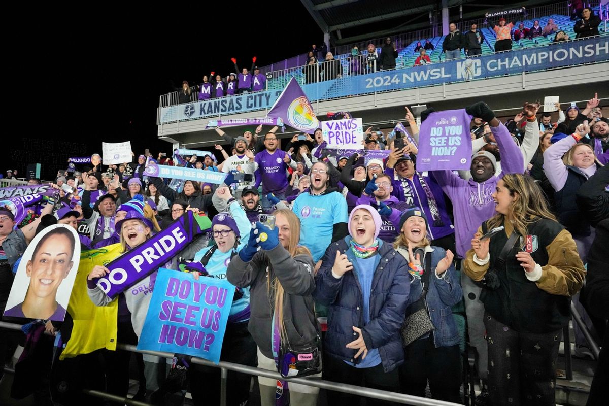 Nov 23, 2024; Kansas City, Missouri, USA; Orlando Pride fans cheer after winning the 2024 NWSL Championship match at CPKC Stadium. Mandatory Credit: Denny Medley-Imagn Images