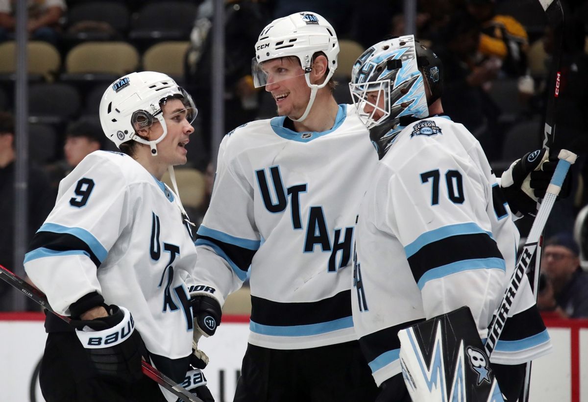 Nov 23, 2024; Pittsburgh, Pennsylvania, USA;  Utah Hockey Club center Clayton Keller (9) and center Nick Bjugstad (middle) and goaltender Karel Vejmelka (70) celebrate after defeating the Pittsburgh Penguins at PPG Paints Arena. Mandatory Credit: Charles LeClaire-Imagn Images