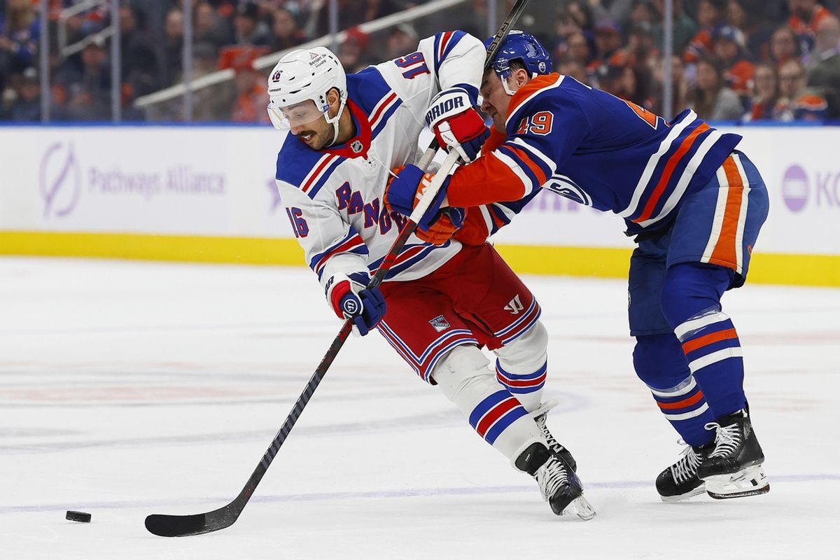 Nov 23, 2024; Edmonton, Alberta, CAN; Edmonton Oilers defensemen Ty Emberson (49) knocks New York Rangers forward Vincent Trocheck (16) off the puck during the second period  at Rogers Place. Mandatory Credit: Perry Nelson-Imagn Images