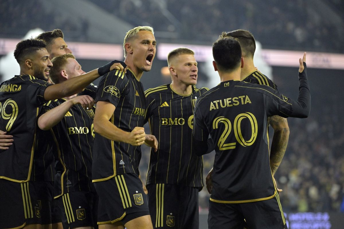 Nov 23, 2024; Los Angeles, California, USA; LAFC defender Aaron Long (33) celebrates after a goal by defender Ryan Hollingshead (24) in the second half against Seattle Sounders FC in a 2024 MLS Cup western conference semifinal match at BMO Stadium. Mandatory Credit: Jayne Kamin-Oncea-Imagn Images