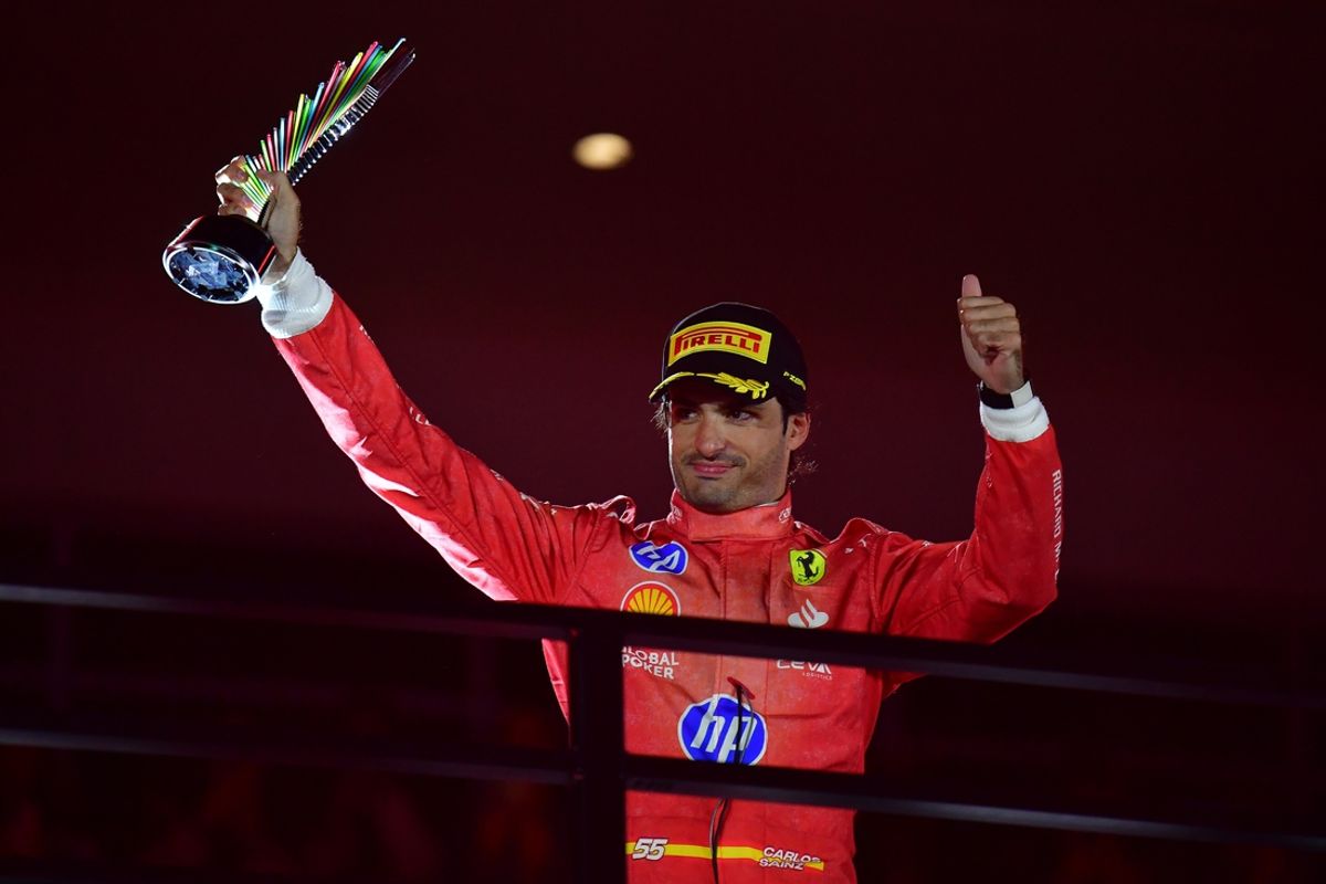 Nov 23, 2024; Las Vegas, Nevada, USA; Scuderia Ferrari driver Carlos Sainz (55) celebrates after placing third in the Las Vegas Grand Prix at Las Vegas Circuit. Mandatory Credit: Gary A. Vasquez-Imagn Images