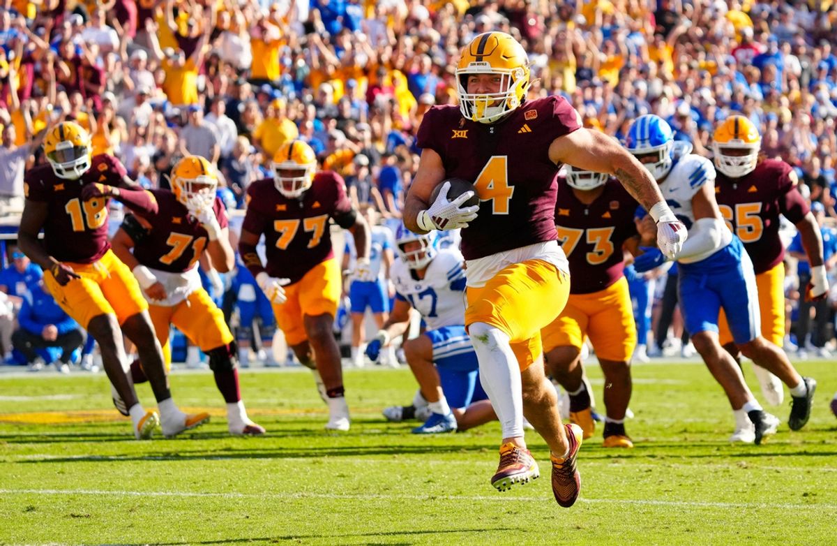 Arizona State running back Cam Skattebo (4) runs into the endzone for a touchdown against BYU during the first half at Mountain America Stadium in Tempe on Nov. 23, 2024.