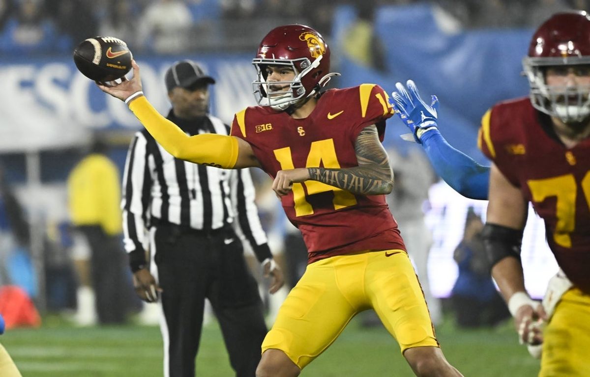 Nov 23, 2024; Pasadena, California, USA; USC Trojans quarterback Jayden Maiava (14) throws a pass during the fourth quarter against the UCLA Bruins at Rose Bowl. Mandatory Credit: Robert Hanashiro-Imagn Images