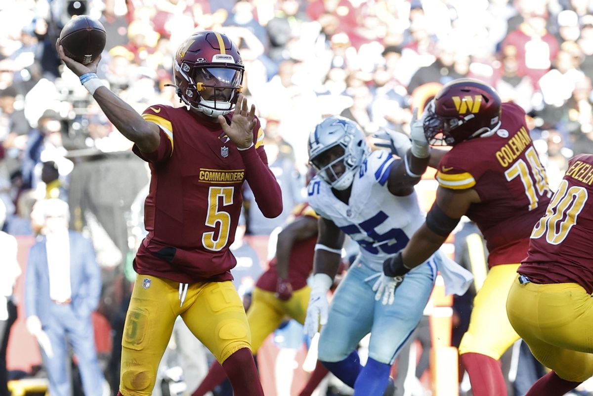Nov 24, 2024; Landover, Maryland, USA; Washington Commanders quarterback Jayden Daniels (5) passes the ball as Dallas Cowboys defensive end Carl Lawson (55) defends during the second quarter at Northwest Stadium. Mandatory Credit: Geoff Burke-Imagn Images